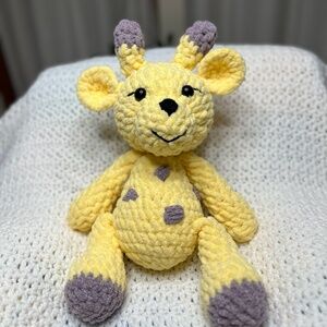 crochet soft yellow giraffe with purple spots